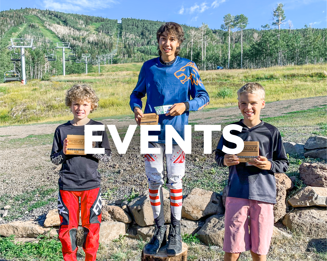 Events Button, young mountain bike racers on podium at Powderhorn Mountain Resort